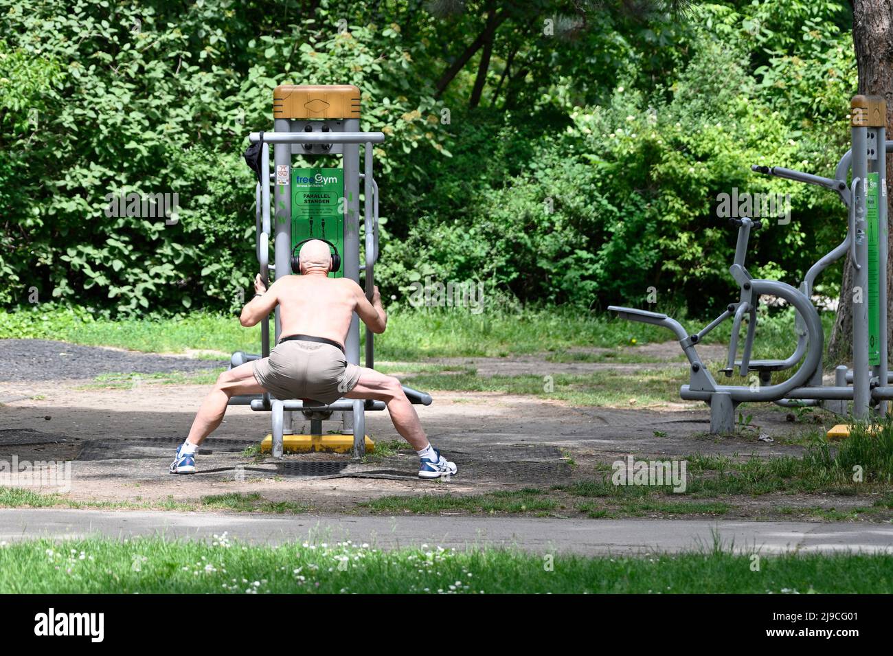 Vienna, Austria. Man on fitness equipment in the park Stock Photo