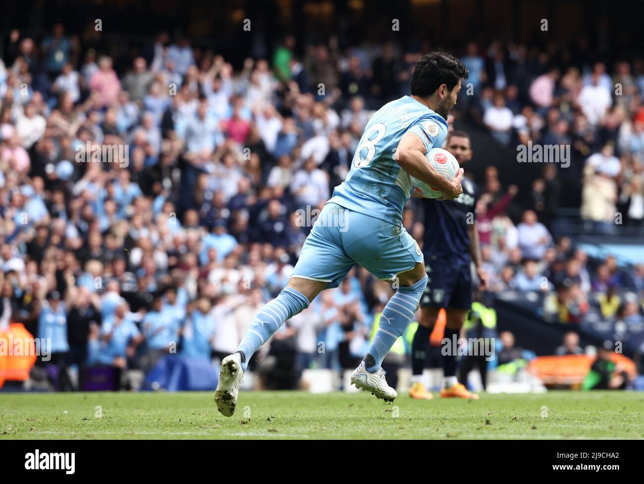 Manchester, UK. 22nd May, 2022. Ilkay Gundogan of Manchester City grabs the ball and heads back to kick off again following his goal during the Premier League match at the Etihad Stadium, Manchester. Picture credit should read: Darren Staples/Sportimage Credit: Sportimage/Alamy Live News Stock Photo
