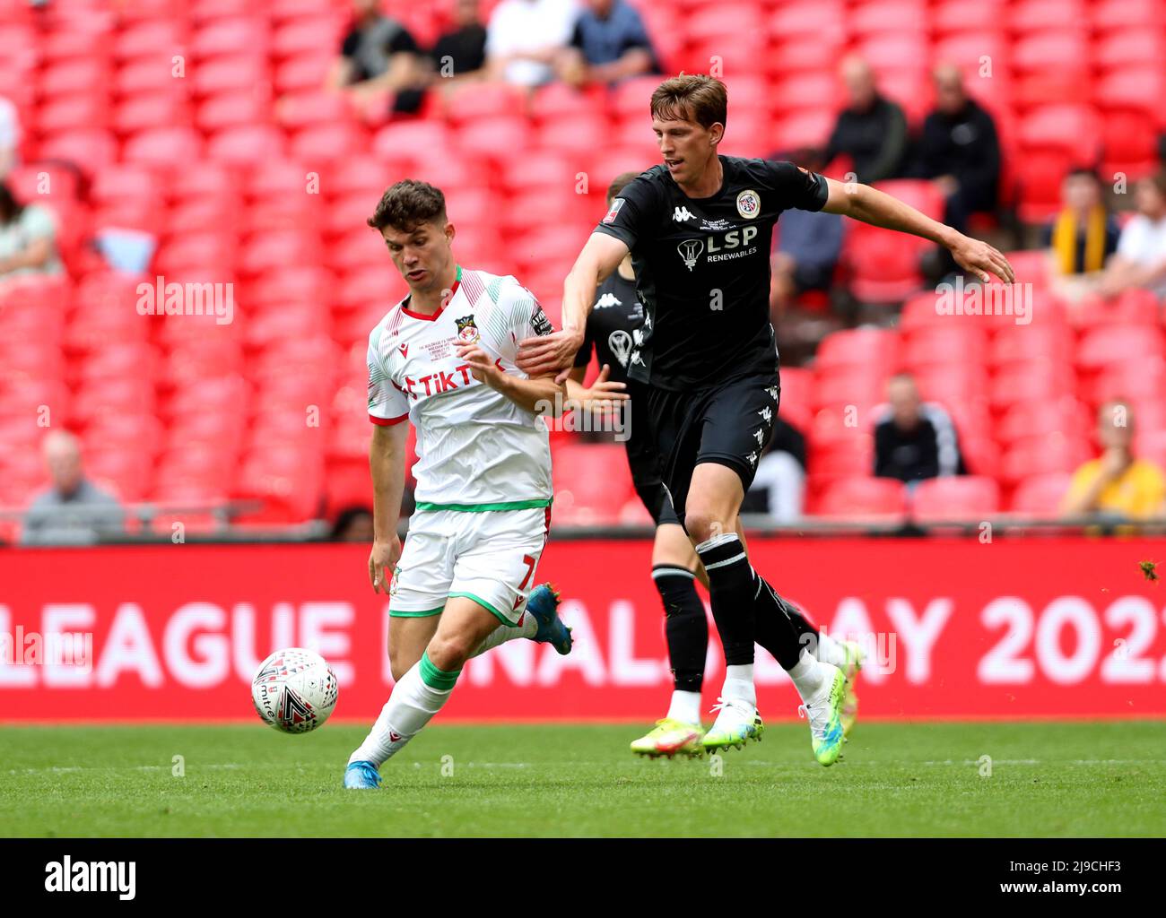 Wrexham's Jordan Davies (left) and Bromley's Joe Partington battle for the  ball during the Buildbase FA Trophy final at Wembley Stadium, London.  Picture date: Sunday May 22, 2022 Stock Photo - Alamy