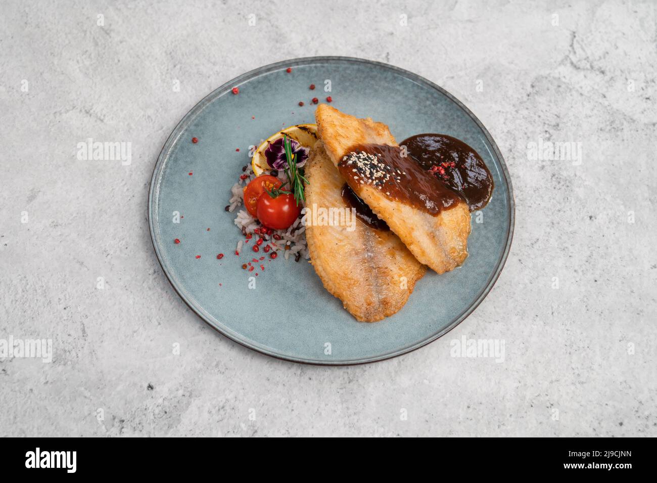 Fried tilapia fish with rice sauce and vegetable Stock Photo Alamy