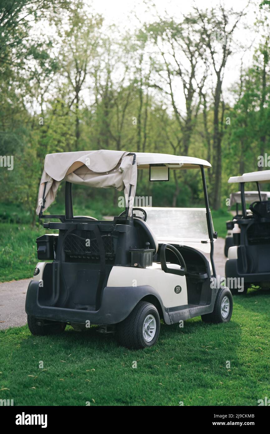 back of a golf cart on a golf course empty no body Stock Photo