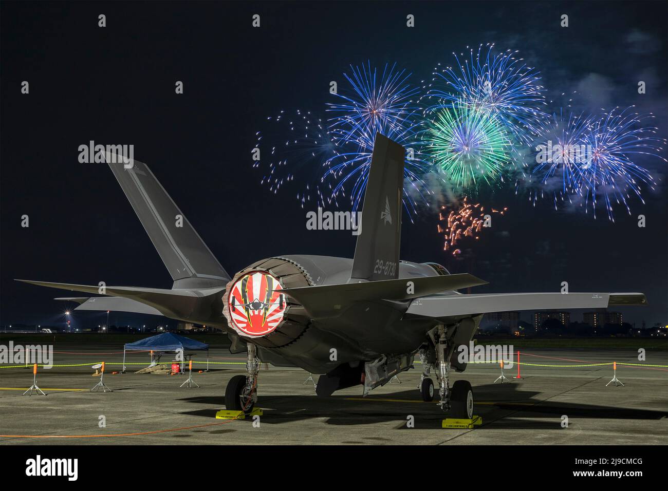 Fussa, Japan. 21st May, 2022. A Japan Air Self-Defense Force F-35A Lightning II Joint Strike Fighter assigned to the 301st Tactical Fighter Squadron sits on the flight-line during a fireworks show part of the Japanese-American Friendship Festival at Yokota Air Base during the Japanese-American Friendship Festival at Yokota Air Base, May 21, 2022 in Fussa, Japan. Credit: Yasuo Osakabe/U.S. Air Force/Alamy Live News Stock Photo