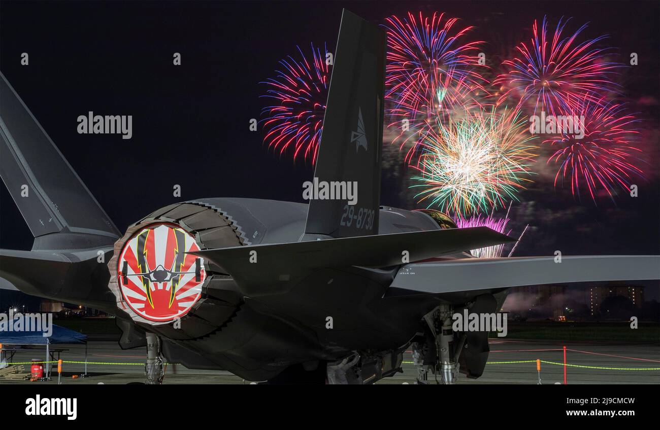 Fussa, Japan. 21st May, 2022. A Japan Air Self-Defense Force F-35A Lightning II Joint Strike Fighter assigned to the 301st Tactical Fighter Squadron sits on the flight-line during a fireworks show part of the Japanese-American Friendship Festival at Yokota Air Base during the Japanese-American Friendship Festival at Yokota Air Base, May 21, 2022 in Fussa, Japan. Credit: Yasuo Osakabe/U.S. Air Force/Alamy Live News Stock Photo