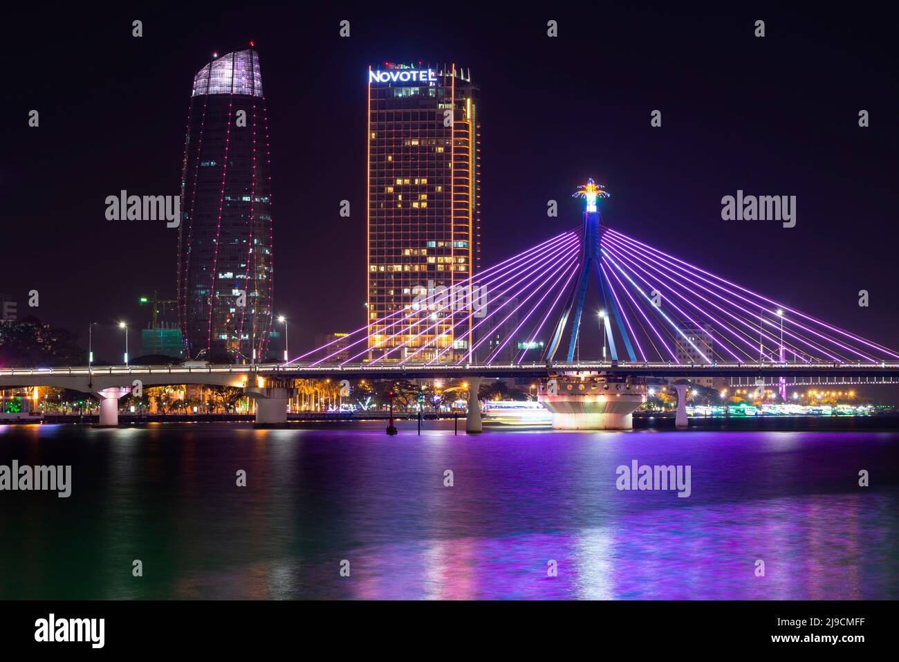 DA NANG, VIETNAM - JANUARY 06, 2016: Cable-stayed bridge in the night urban landscape. Da Nang, Vietnam Stock Photo