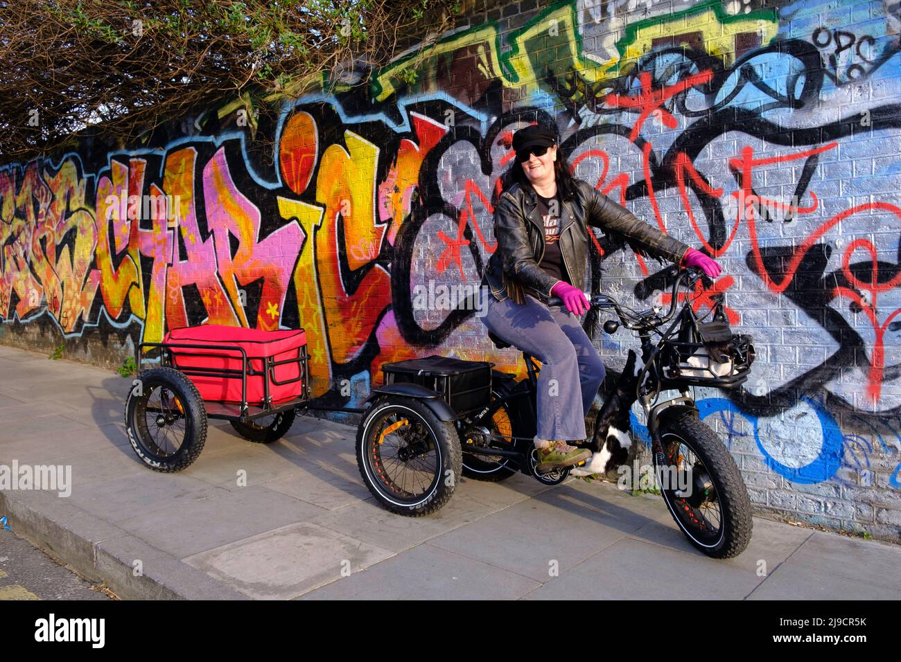 Lady on tricycle,  Hackney Wick, London, UK Stock Photo