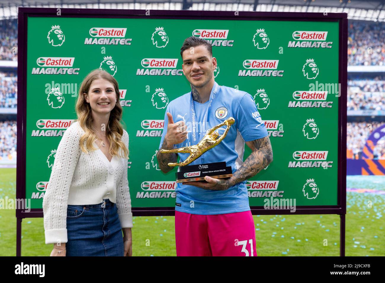 Manchester City's Ederson is presented with the Premier League