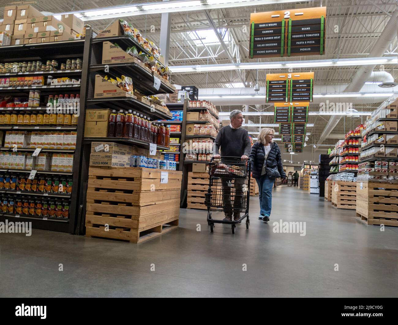 Mill Creek, WA USA circa May 2022 View of an older couple pushing a