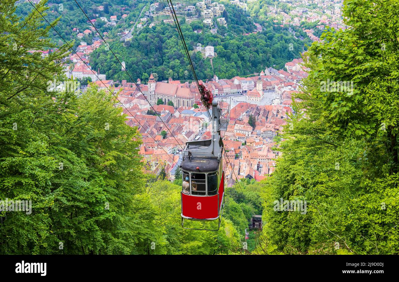 Brasov, Romania. Tampa mountain  cable car  with the medieval city in the background. Stock Photo