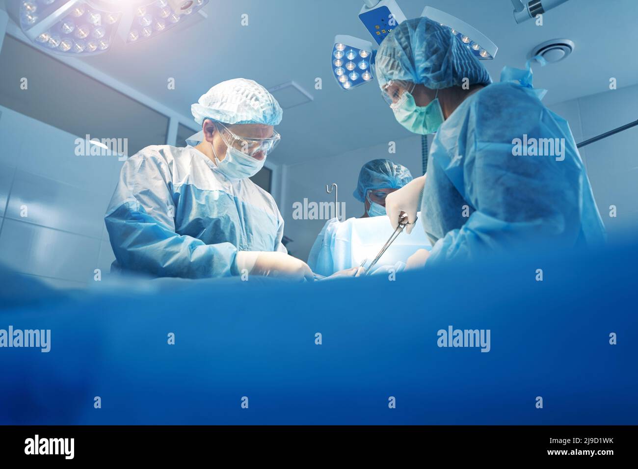 Physicians doing surgery work in operation theater Stock Photo - Alamy