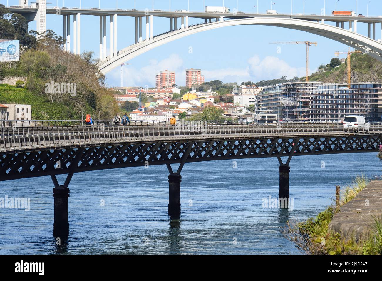 Cais das Pedras Viaduct over the Douro River in Porto, with the Arrabida Bridge in the background. Stock Photo