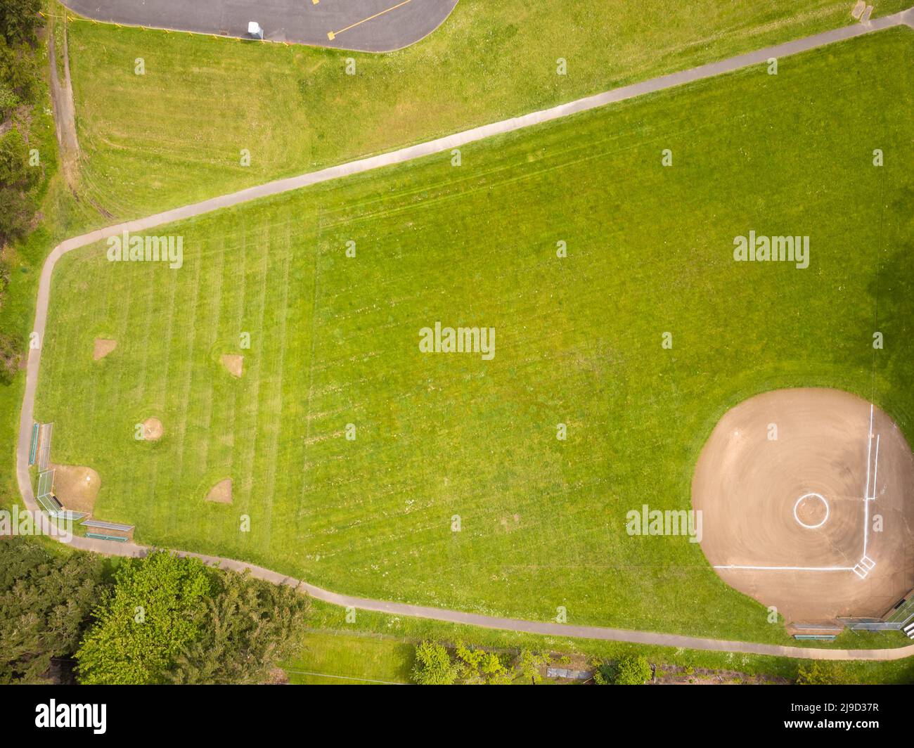 Green sports field with markings, lawn. Sports games - football, volleyball, baseball, rugby, golf. Professional and amateur sports. Matches, champion Stock Photo