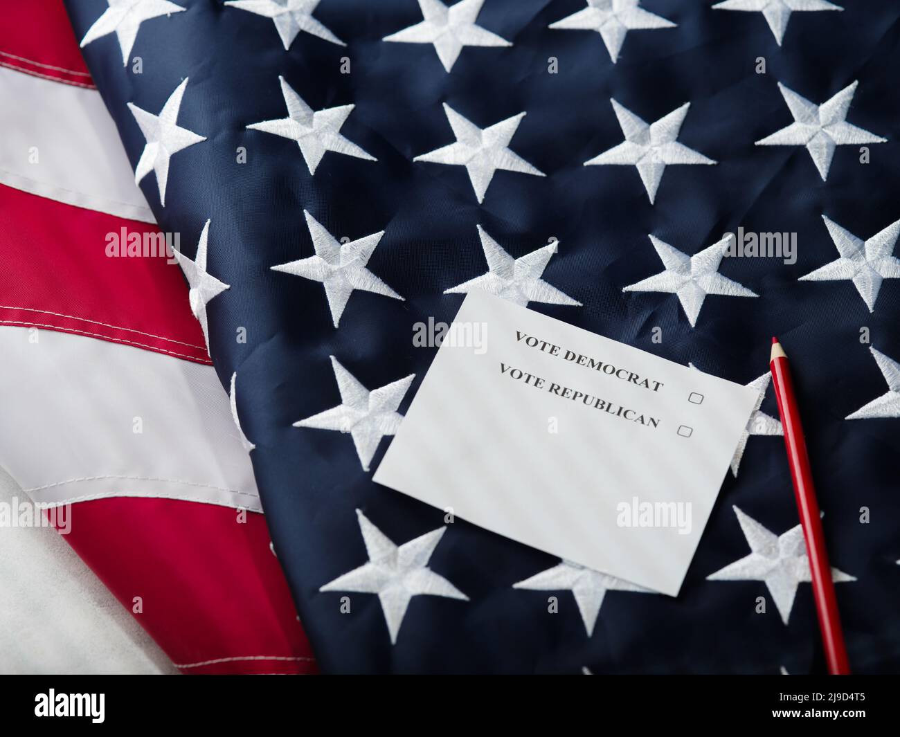 On the American flag, a pencil and a call - vote democracy, vote Republicans. Election campaign, democracy, independence, debate, voting, elections, U Stock Photo