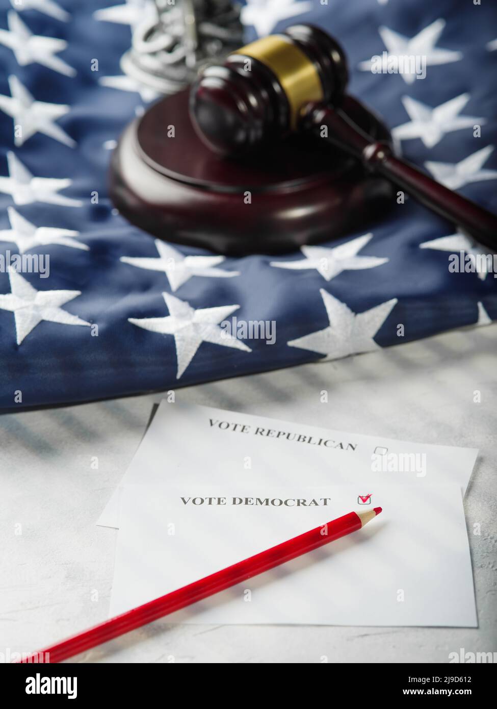 An American flag, a judge's gavel, and a leaflet calling for votes for Republicans and Democrats. The right to choose, freedom of choice, the constitu Stock Photo