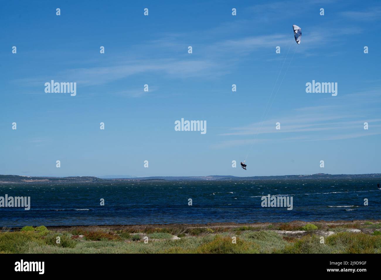 Flying kytesurfer in the air Stock Photo