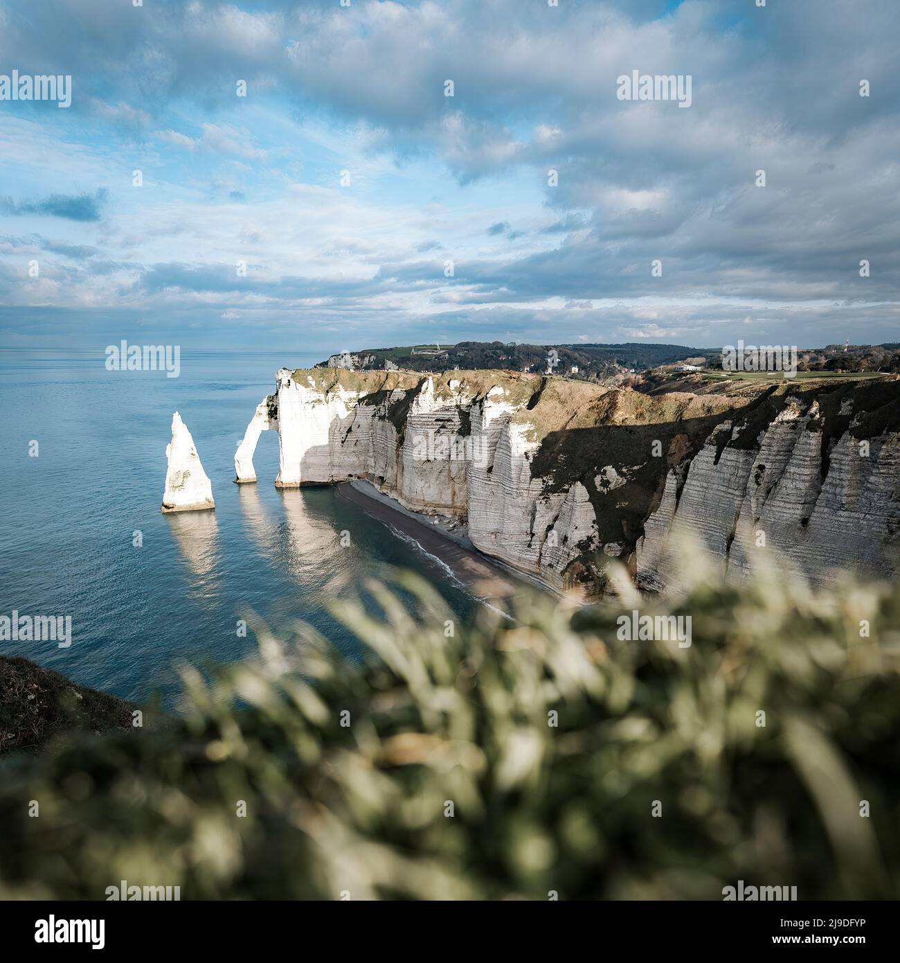 Coastal landscape along the Falaise d'Aval the famous white cliffs of Etretat village Stock Photo