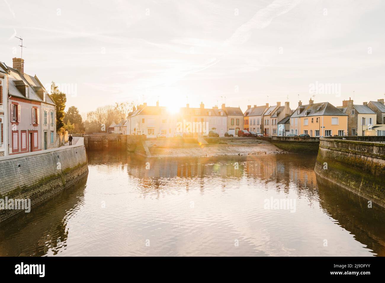 The Harbor of Isigny sur Mer during the sunrise at high tide Stock Photo
