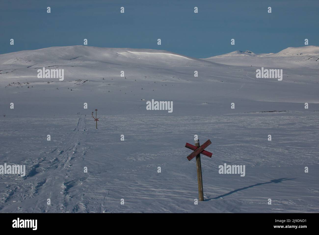 Kungsleden skiing and snowmobile trail between Serve and Aigert Mountain huts during the winter season, Sweden Stock Photo