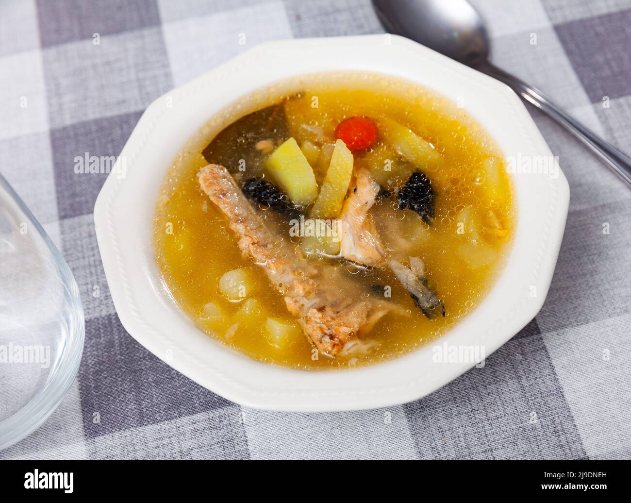 Fish soup with salmon bones and vegetables Stock Photo Alamy