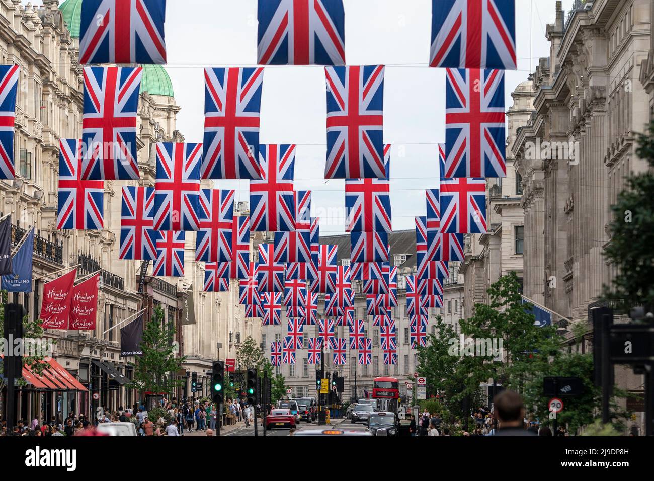 Union Jack flags hang in Regents Street in London ahead of the Platinum Jubilee celebration Stock Photo