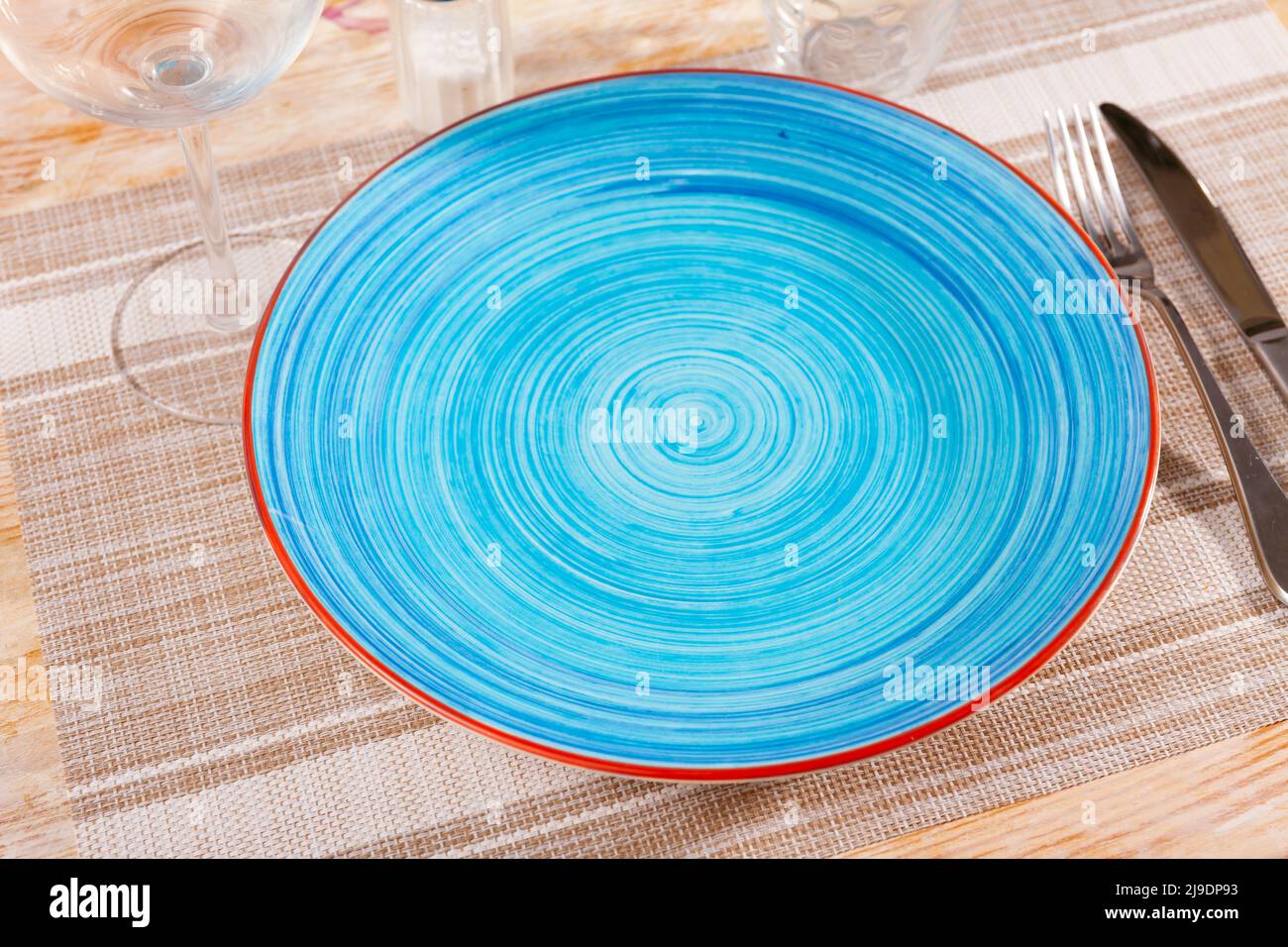 Empty plate with fork and knife Stock Photo - Alamy
