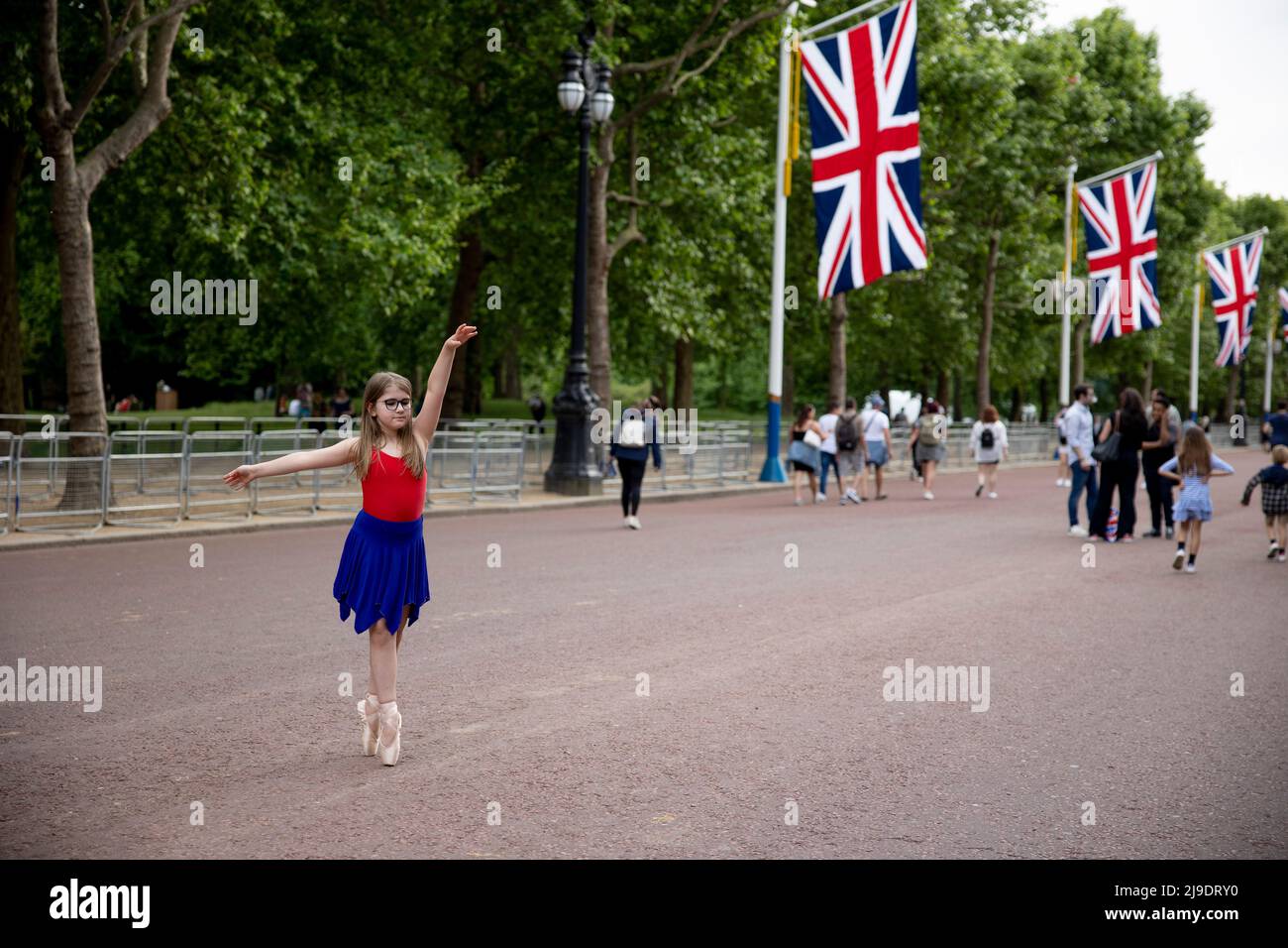 London, UK. 22nd May, 2022. A girl is seen dancing ballet in front of the Union Jack flags in St James Park. Union Jack flags decoration are seen in central London in preparation for the Queen's Platinum Jubilee, marking the 70th anniversary of the Queen's accession to the throne. A special extended Platinum Jubilee Weekend will take place 2nd-5th June. (Photo by Hesther Ng/SOPA Images/Sipa USA) Credit: Sipa USA/Alamy Live News Stock Photo