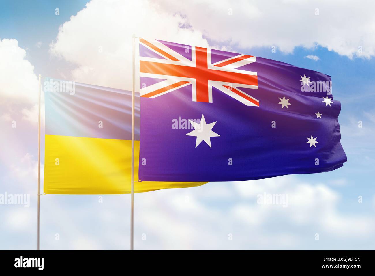 Sunny blue sky and flags of australia and ukraine Stock Photo