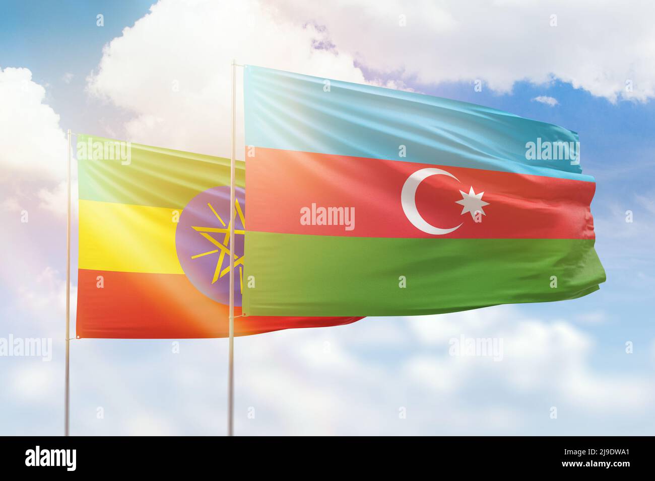 Sunny blue sky and flags of azerbaijan and ethiopia Stock Photo