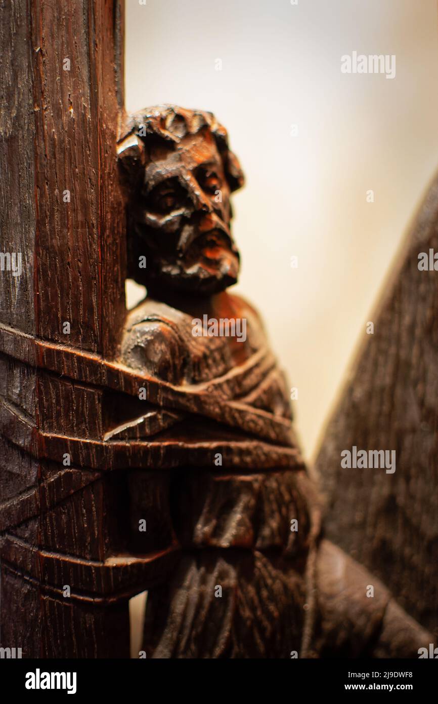 A wood carving of a man tied in ropes as part of a chair at the 1926