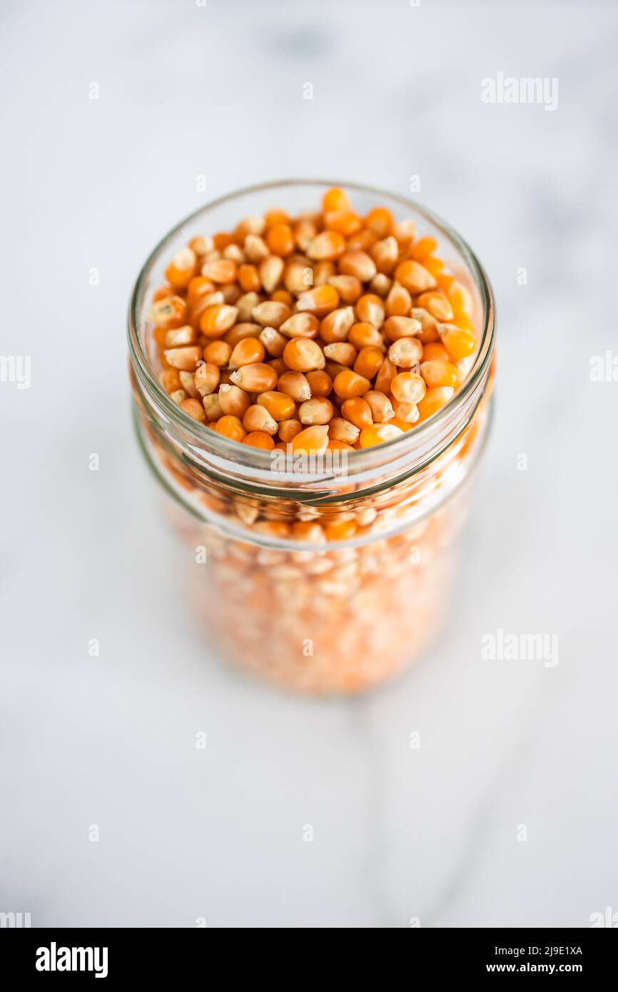 corn kernels for making popcorn in glass jar, concept of simple natural
