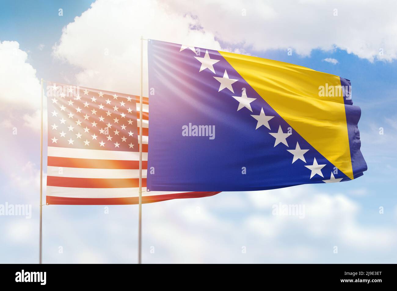 Sunny blue sky and flags of bosnia and usa Stock Photo - Alamy