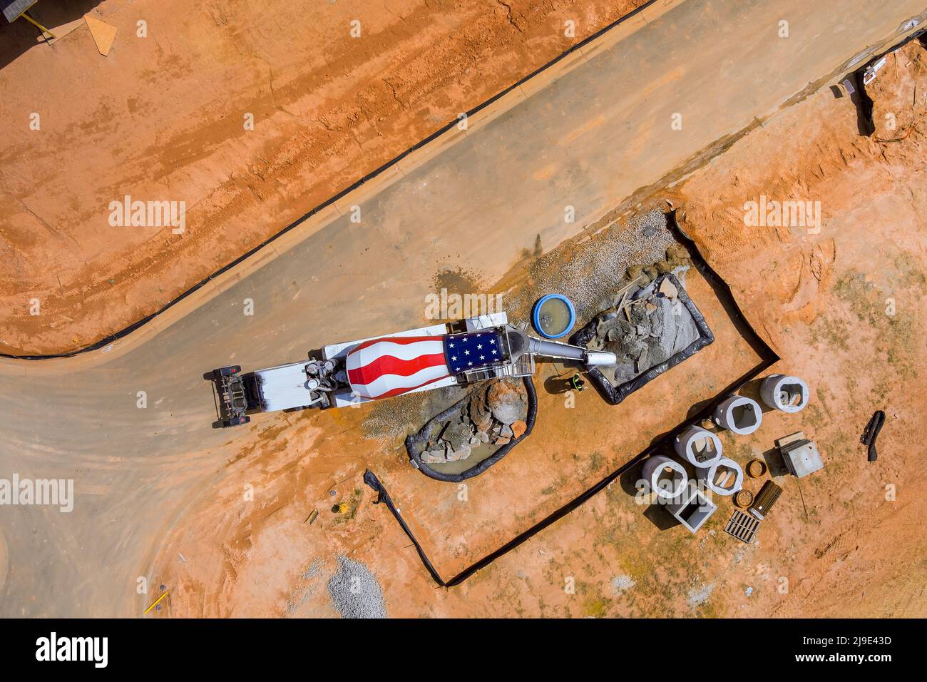 Aerial view cement mixer truck is working and pouring cement during for