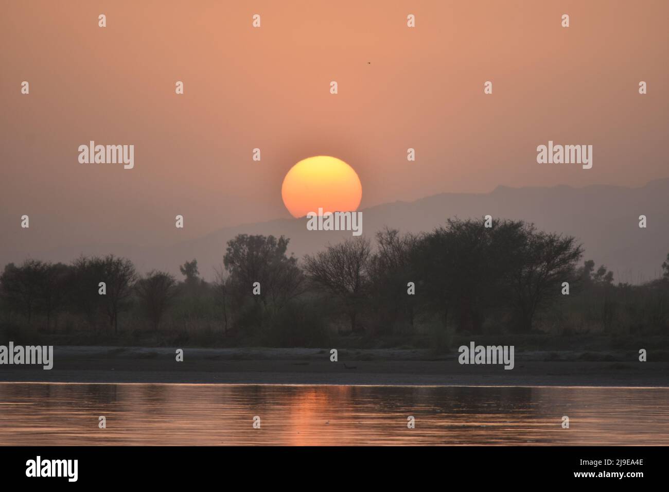 sunset on the river Stock Photo - Alamy