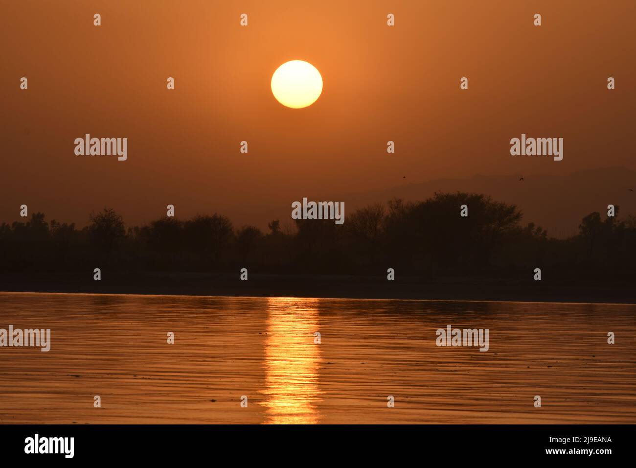 sunset on the river Stock Photo - Alamy
