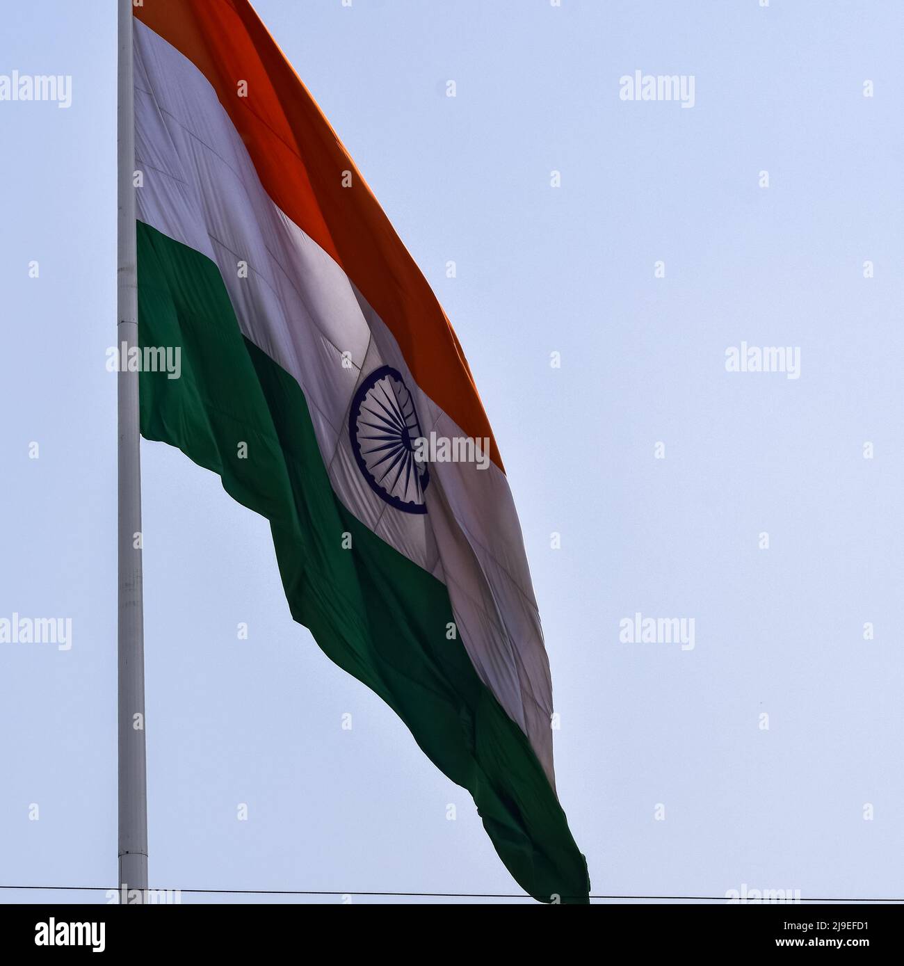 India flag flying high at Connaught Place with pride in blue sky, India flag  fluttering, Indian Flag on Independence Day and Republic Day of India, ti  Stock Photo - Alamy