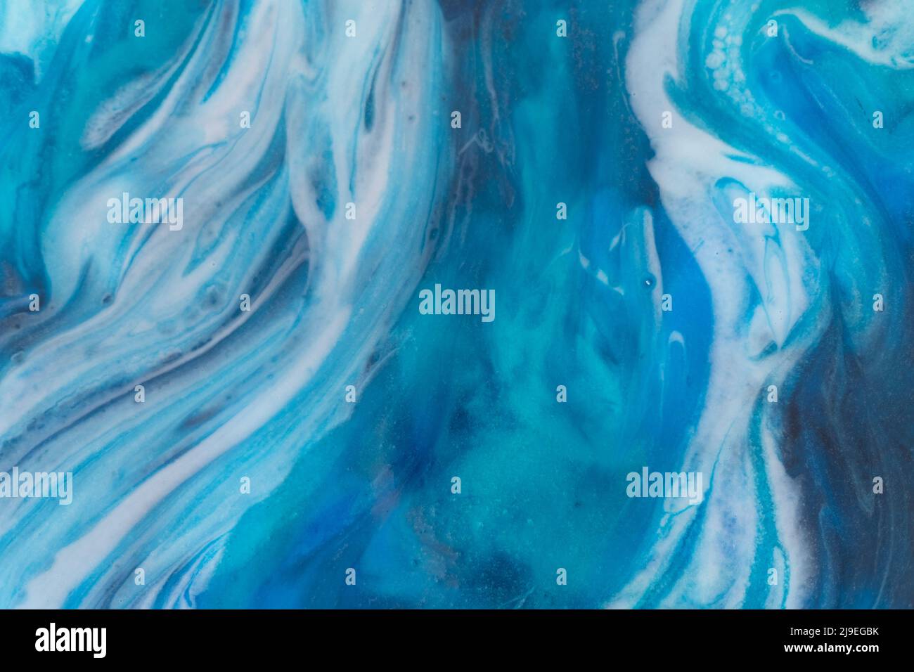 Epoxy resin art. Texture of blue and white paint. Fluid art, kintsugi ...