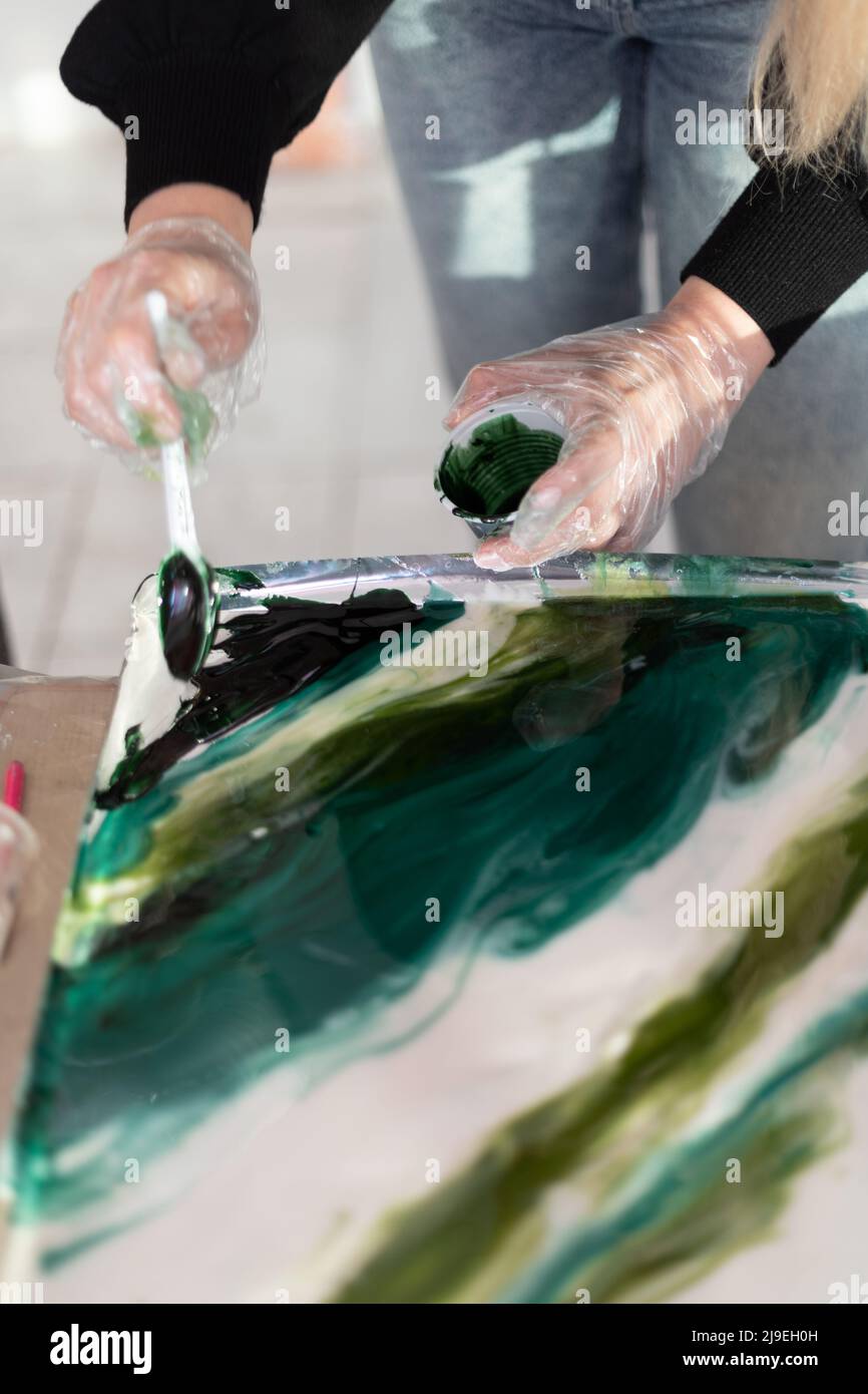 Stabilizing Abstract Epoxy resin different blue color in cup for casting stabilizing wood ...