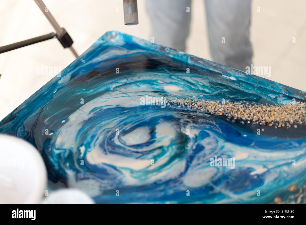 Epoxy resin different blue color in cup for casting stabilizing wood,  abstract art. Process of making accessory from resin.Mixing colorful of  resin Stock Photo - Alamy