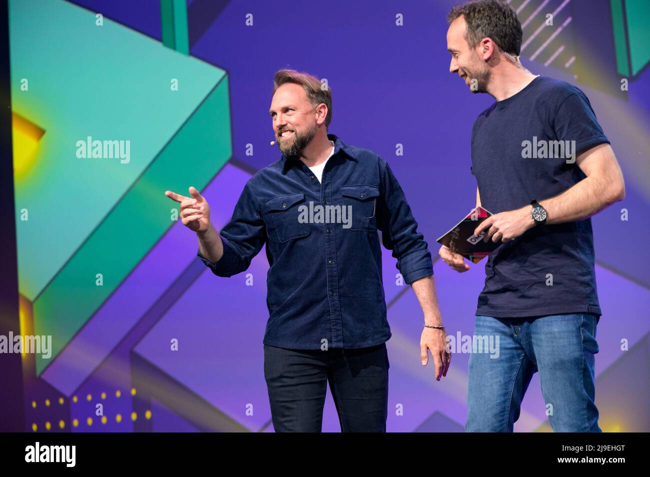 Hamburg, Germany. 18th May, 2022. Presenter Steven Gätjen joins OMR CEO Philipp Westermeyer (R) on stage. The OMR digital festival in Hamburg focuses on a combination of trade fair, workshops and party. Credit: Jonas Walzberg/dpa/Alamy Live News Stock Photo