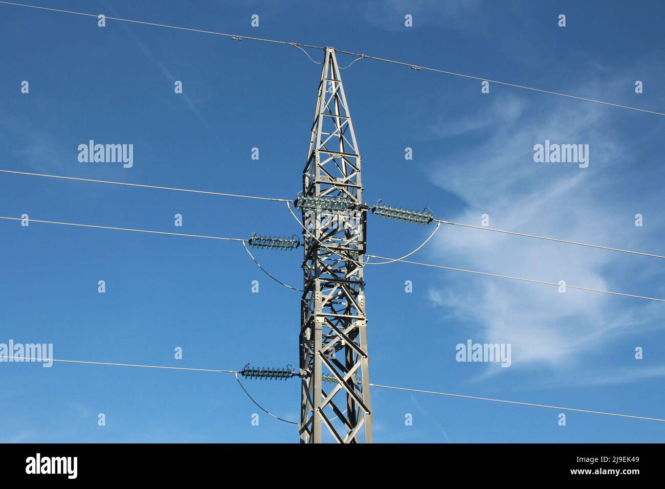 High voltage electric pylon on the sky background Stock Photo
