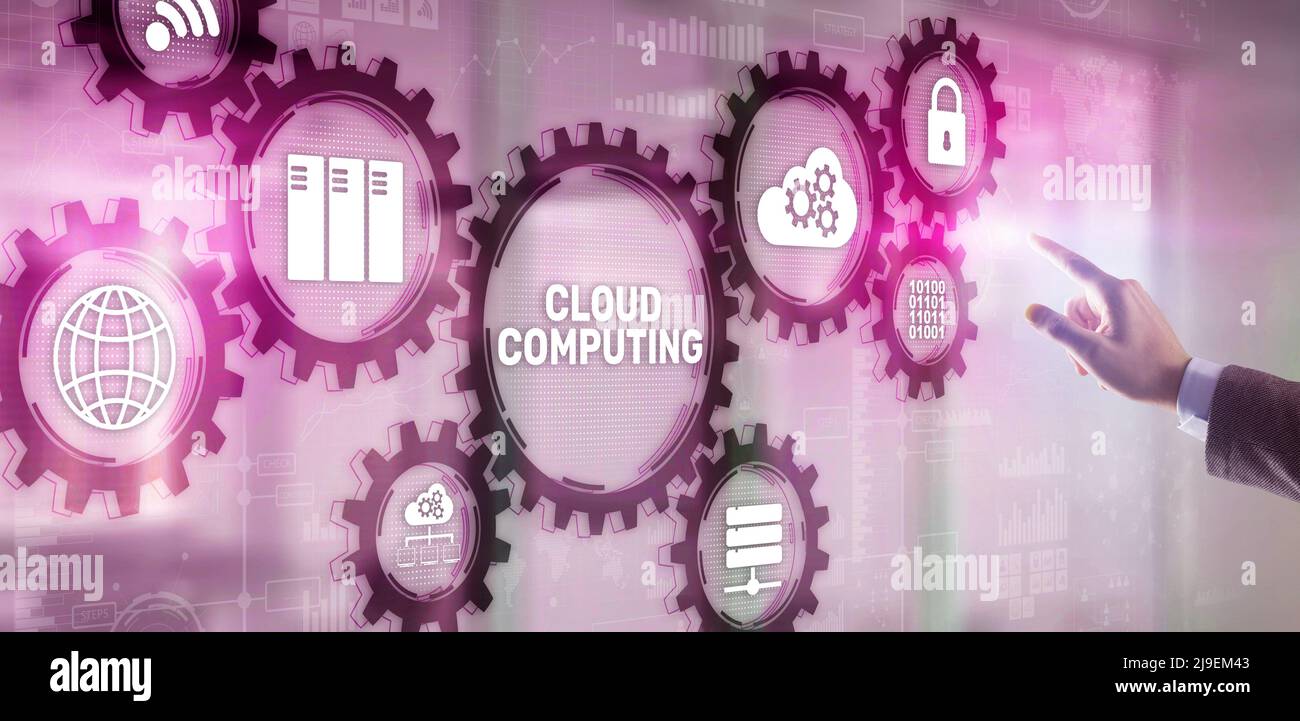 Cloud computing concept. Businessman is pressing on the virtual screen inscription Cloud computing Stock Photo
