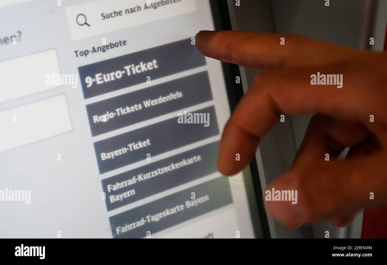 Garmisch Partenkirchen, Germany. 23rd May, 2022. A man buys a 9-euro ticket  at a Deutsche Bahn (DB) ticket vending machine. The German government  presented an energy relief package at the end of