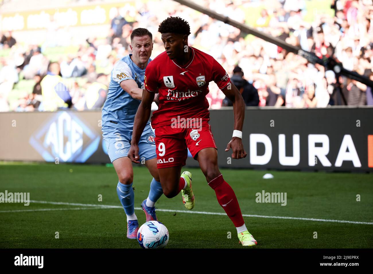 Melbourne, Australia, 22 May, 2022. Kusini Yengi of Adelaide United controls the ball ahead of Scott Jamieson of Melbourne City FC during the A-League Semi Final soccer match between Melbourne City FC and Adelaide United at AAMI Park on May 22, 2022 in Melbourne, Australia.during the A-League Semi Final soccer match between Melbourne City FC and Adelaide United at AAMI Park on May 22, 2022 in Melbourne, Australia. Credit: Dave Hewison/Speed Media/Alamy Live News Stock Photo