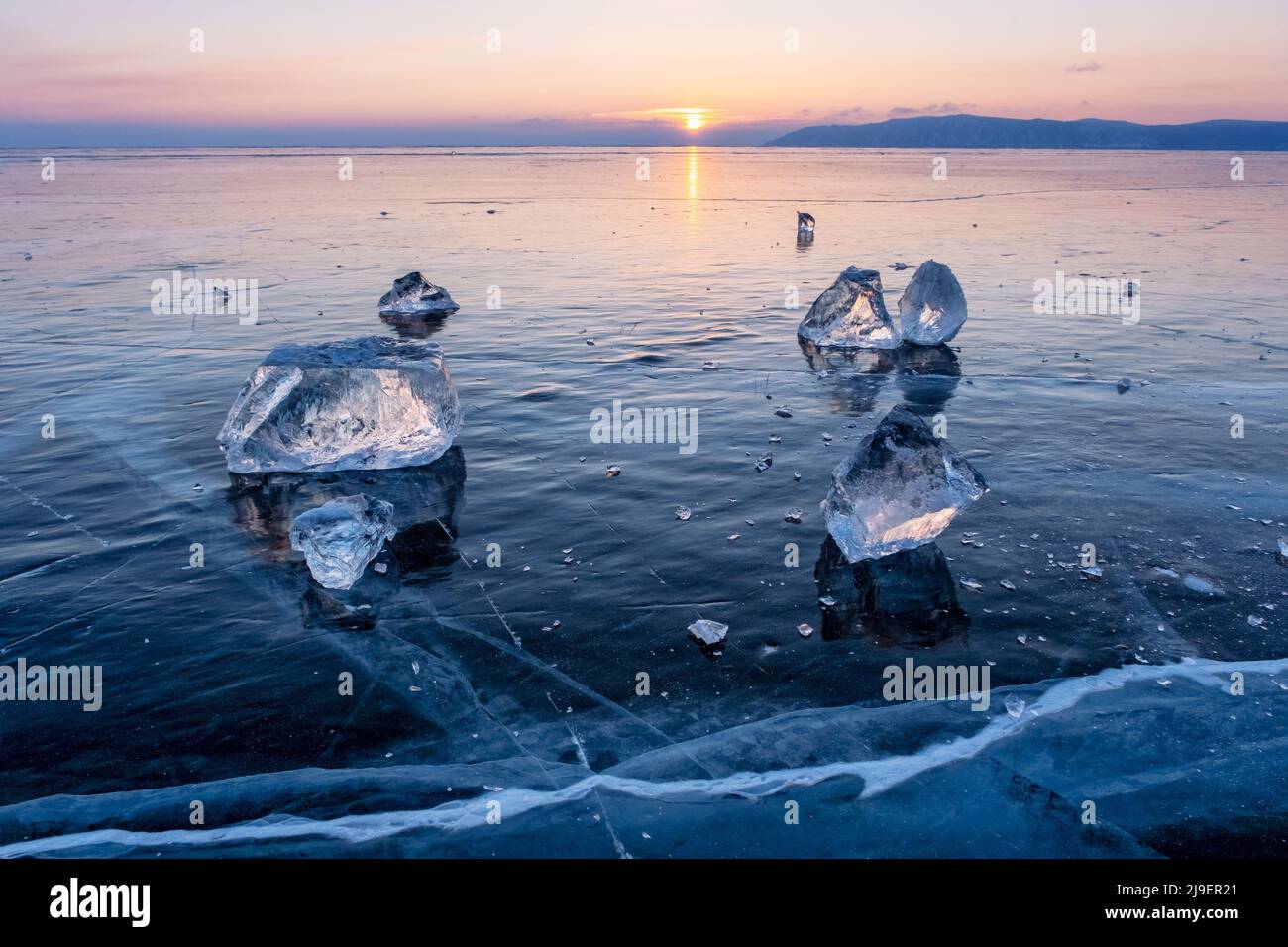 Sunset on frozen Lake Baikal Stock Photo