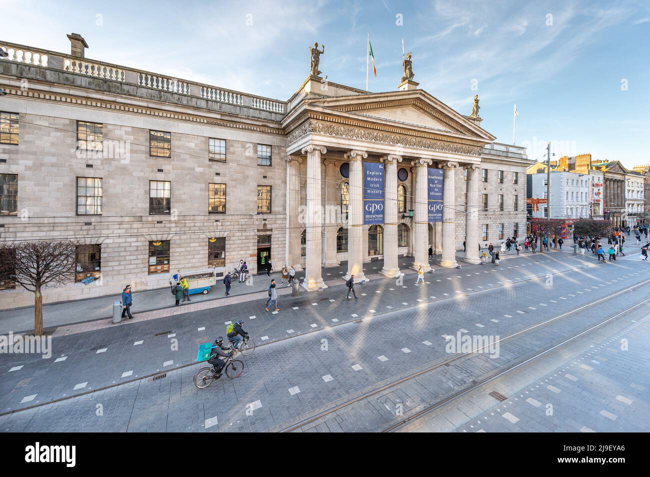 Luas tram passes in front of the GPO and Dublin Spire on a busy O'Connell Street, Dublin, Ireland Stock Photo