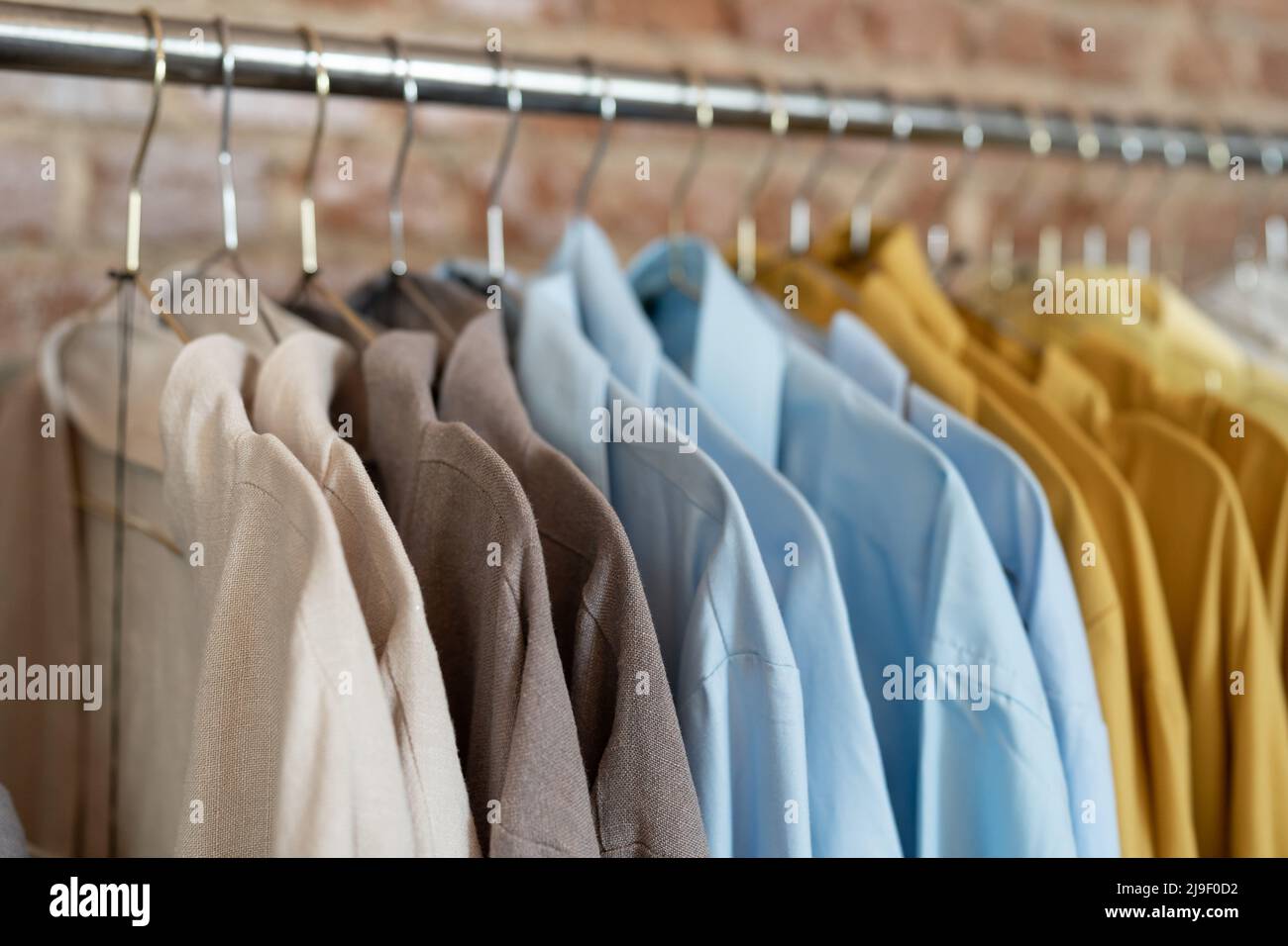 Organic eco clothes on hanger in store. Homemade clothing from natural and processed fabrics