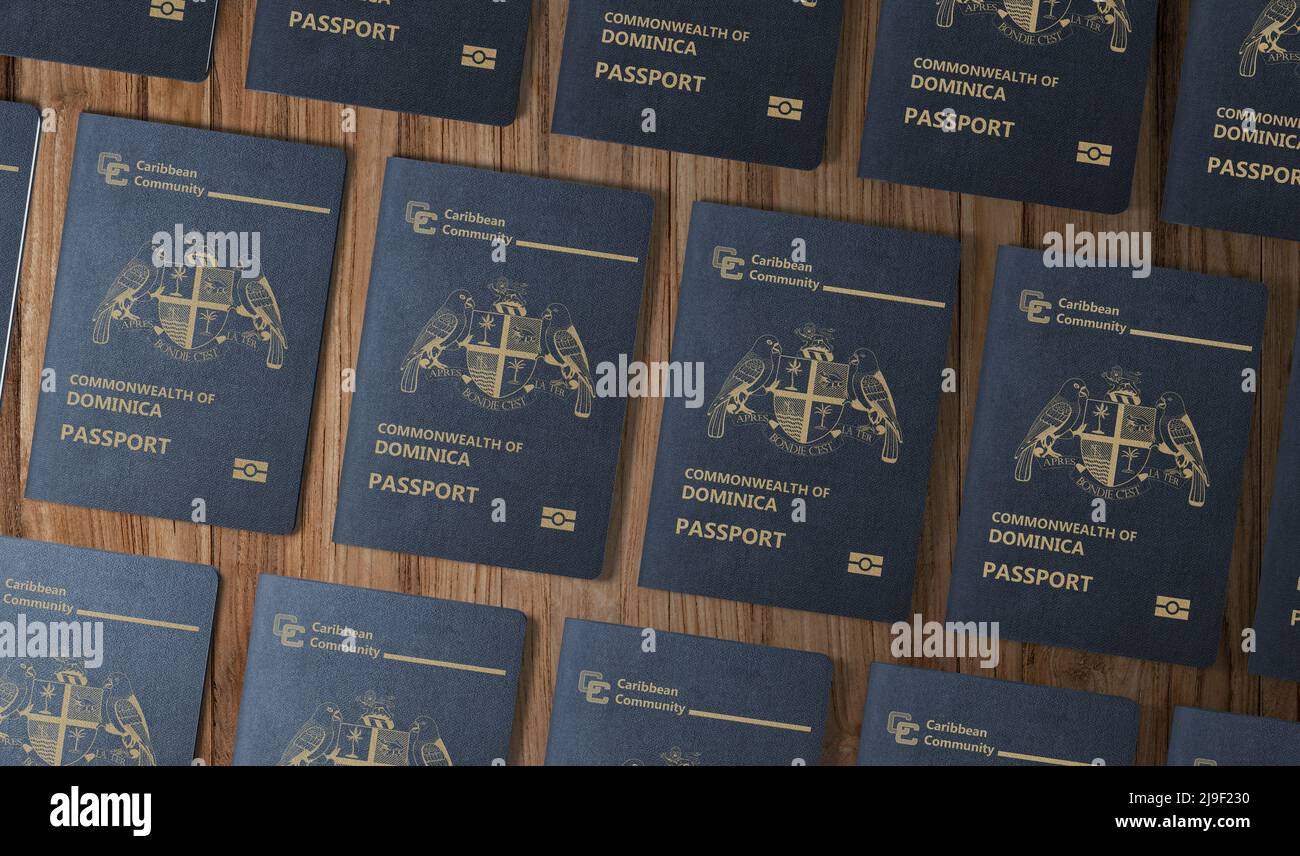 Passports of the Caribbean state of New Dominica , top view, on a wooden table Stock Photo