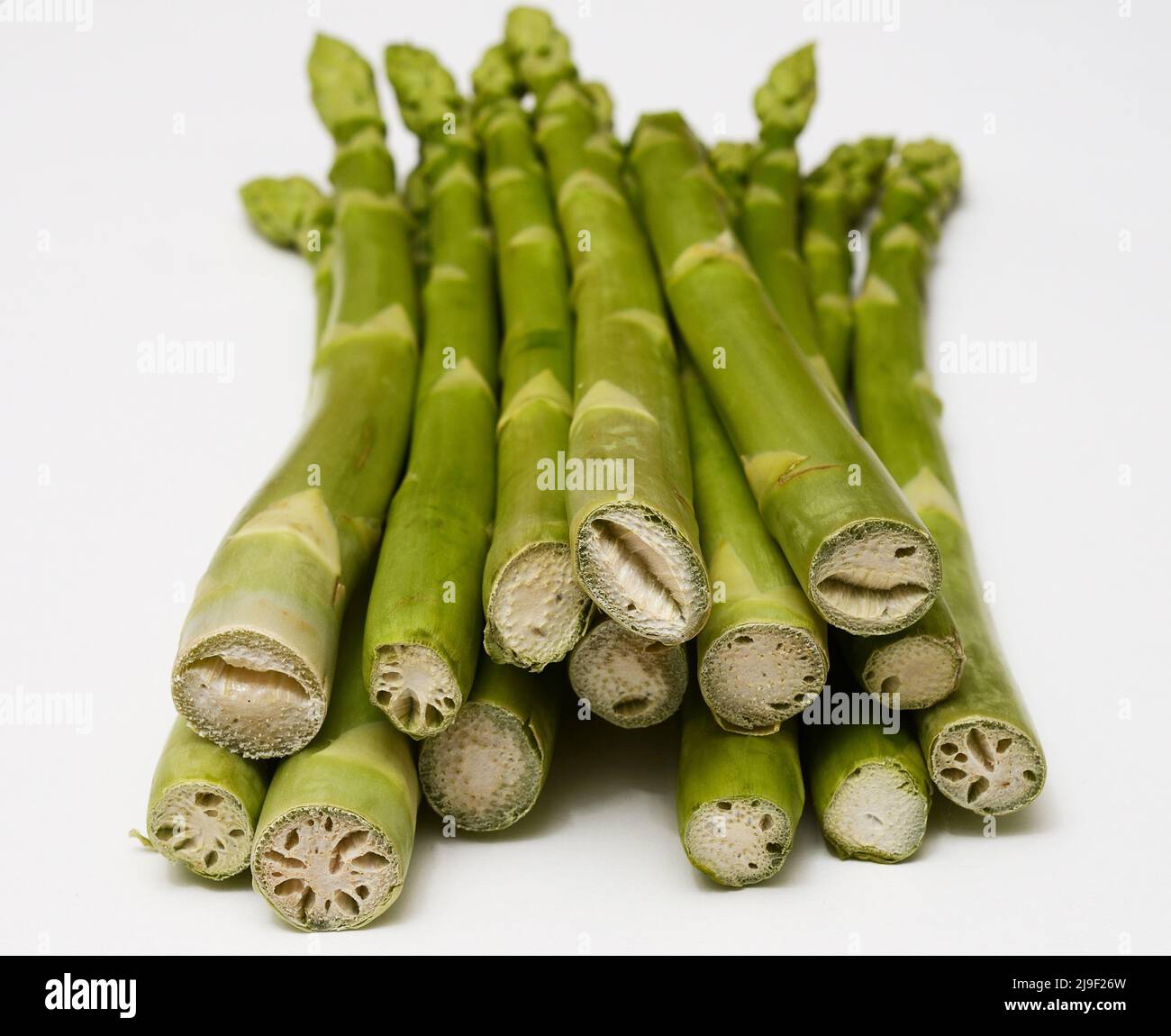 a bunch of asparagus on a white background Stock Photo