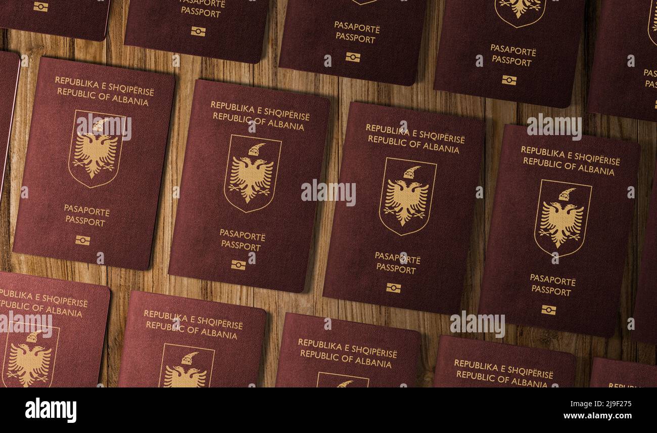 Passports of Albanian , top view, on a wooden table ,The Albanian passport is a travel document issued Stock Photo