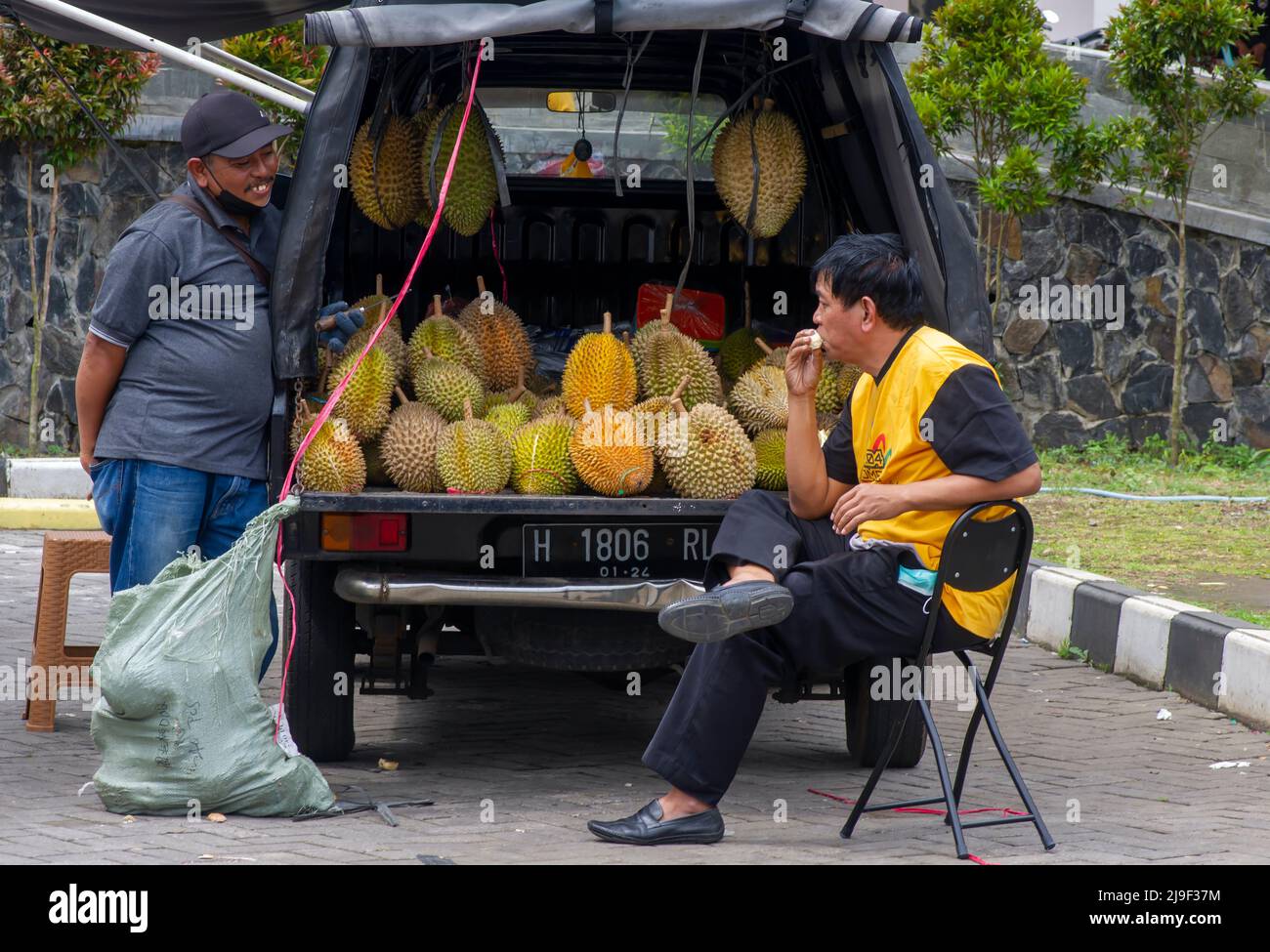 Semarang, Indonesia - January 12, 2022: A durian fruit seller and buyer in front of the delicious ripe durians Stock Photo