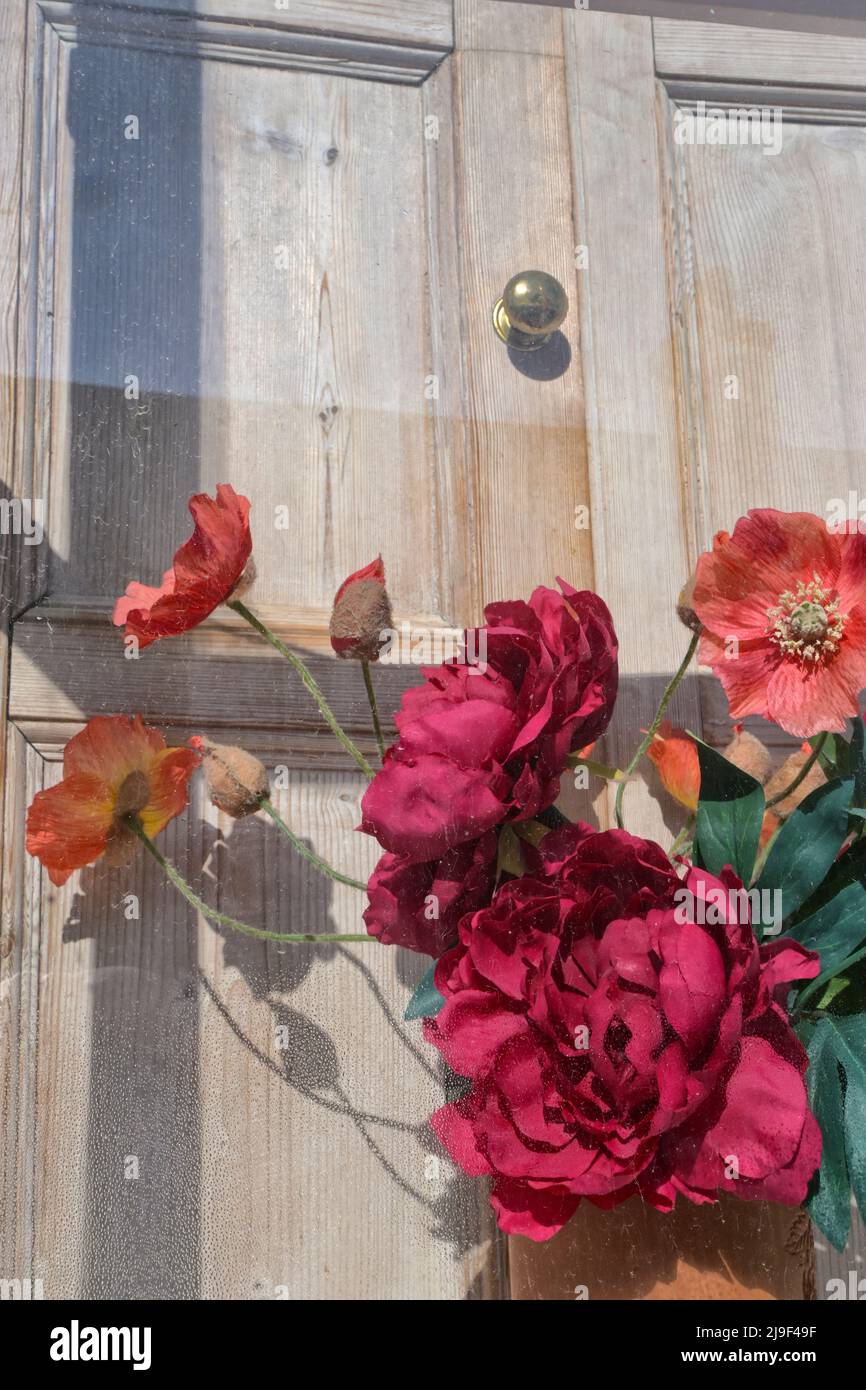 artificial flowers in window, england Stock Photo Alamy